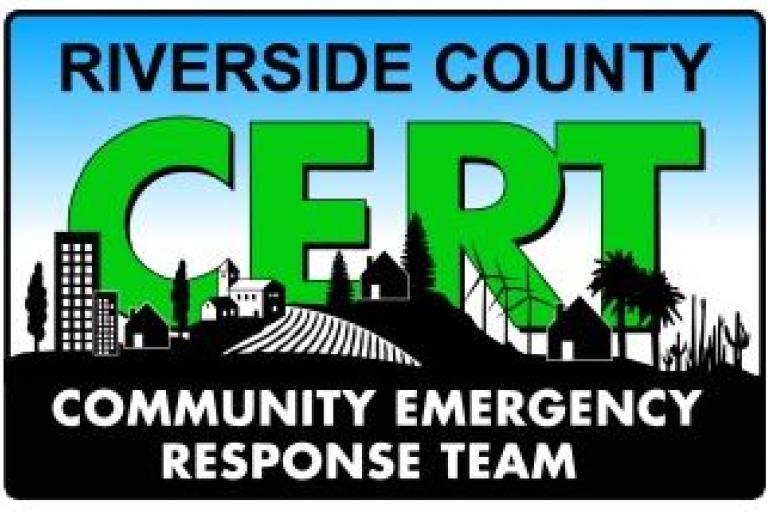 "Riverside County CERT" Logo in green and black lettering with a black and white city shadow in the background 