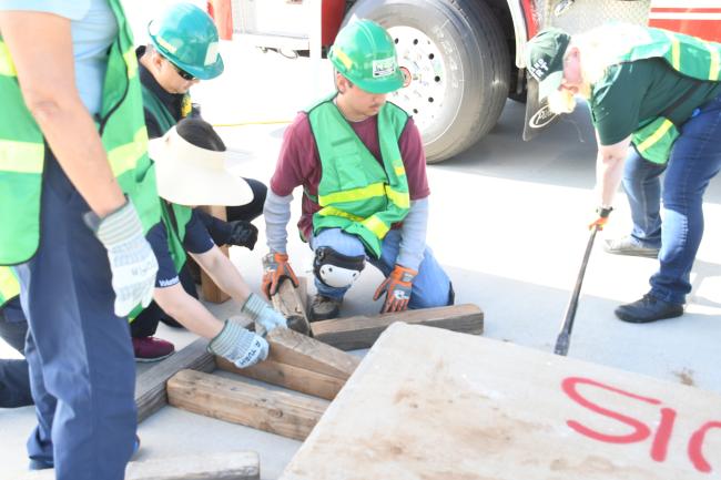 Picture of a group of people cribbing.